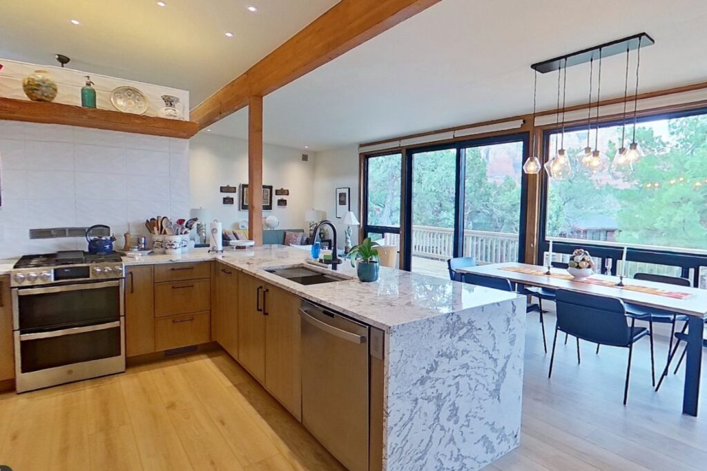 marble kitchen counter light wood floors